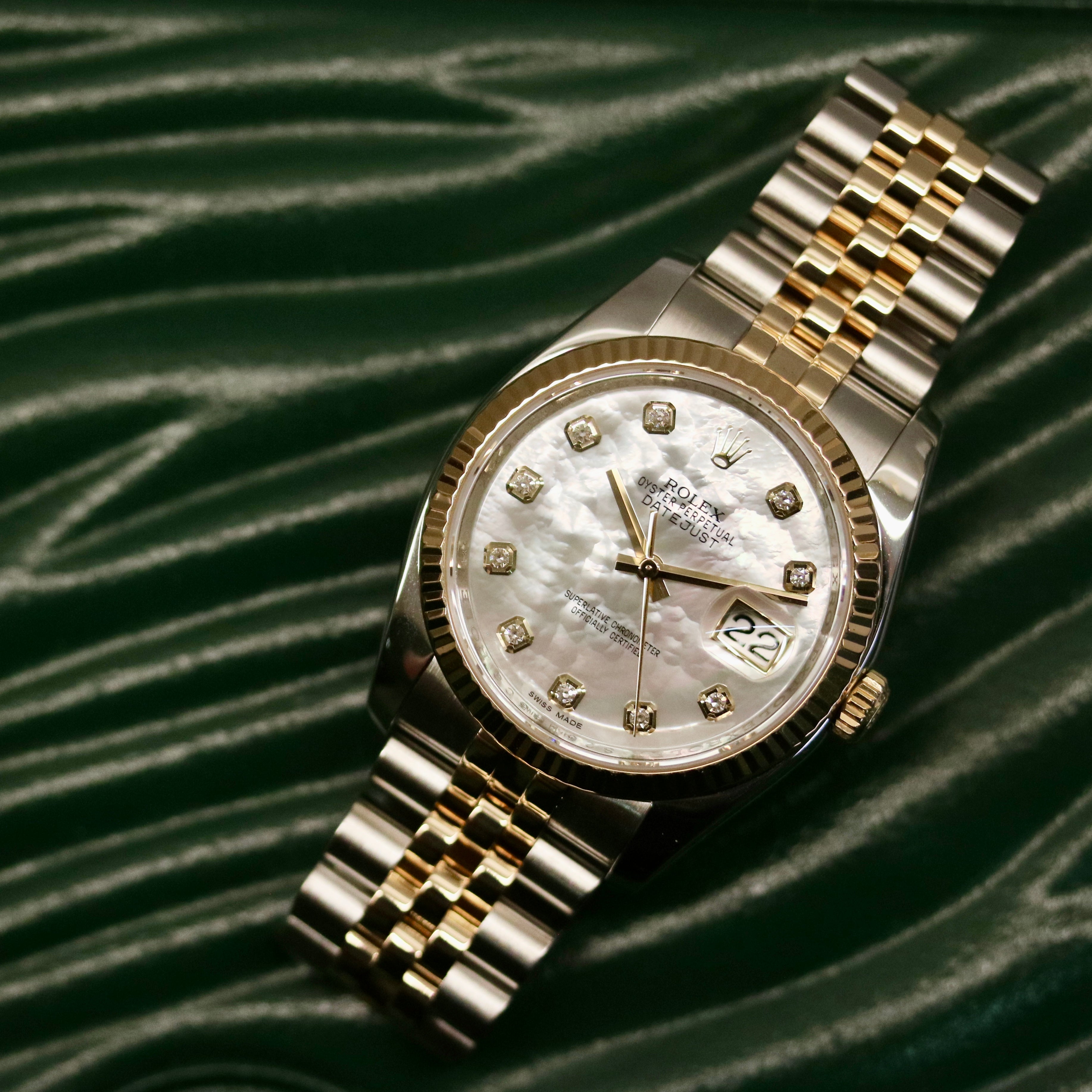 Rolex Datejust 36 ref. 116233 from 2013 in steel and yellow gold with a factory white mother-of-pearl diamond dial, 36mm case, Jubilee bracelet, sapphire crystal, and automatic movement. Detailed product photos showing the dial texture, diamond markers, two-tone case and bracelet, fluted bezel, and overall condition. Includes original Swedish papers from Nymans Ur, original receipt, 2020 service card, box, and tags, offered by Klocksalongen with a 12-month functional warranty.