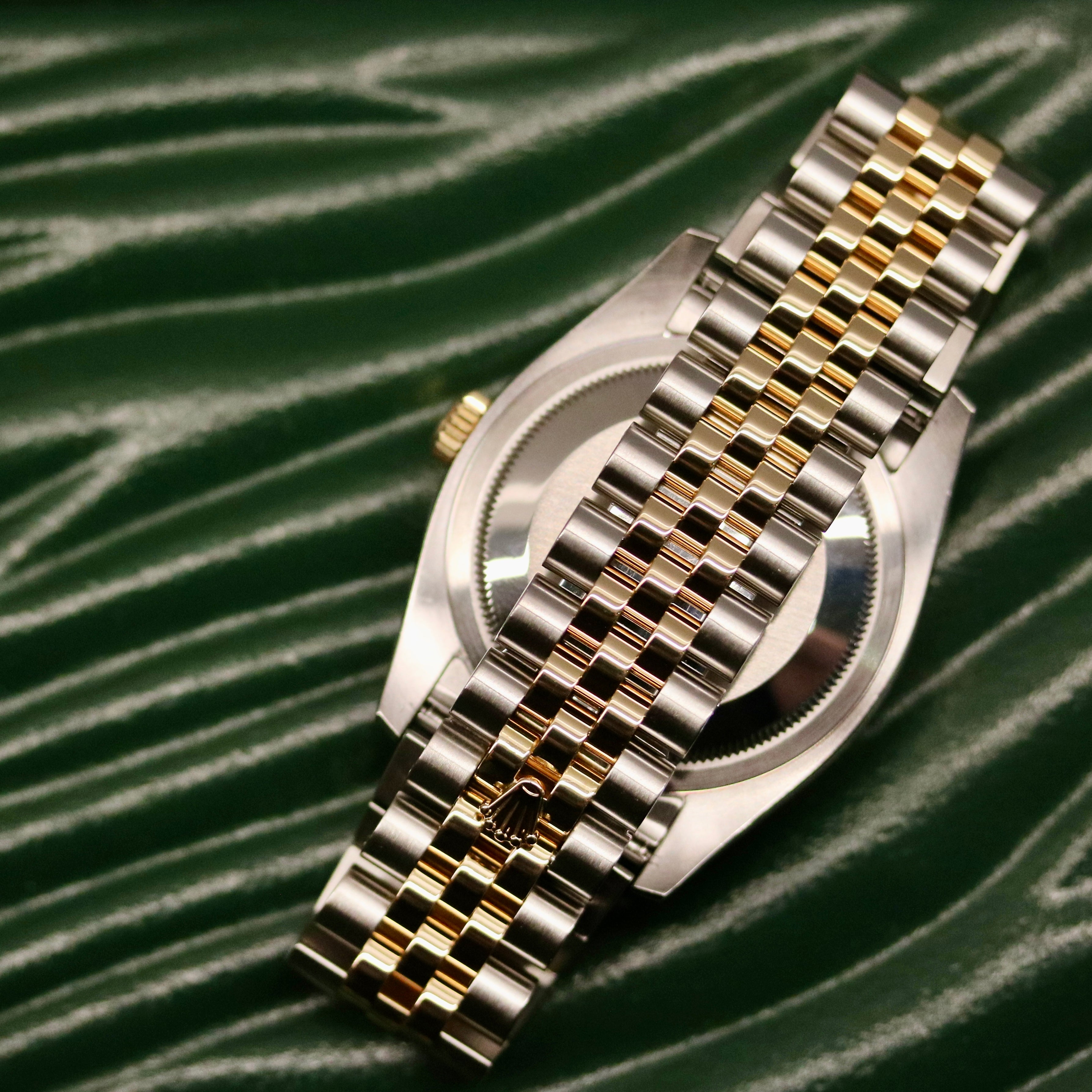 Rolex Datejust 36 ref. 116233 from 2013 in steel and yellow gold with a factory white mother-of-pearl diamond dial, 36mm case, Jubilee bracelet, sapphire crystal, and automatic movement. Detailed product photos showing the dial texture, diamond markers, two-tone case and bracelet, fluted bezel, and overall condition. Includes original Swedish papers from Nymans Ur, original receipt, 2020 service card, box, and tags, offered by Klocksalongen with a 12-month functional warranty.