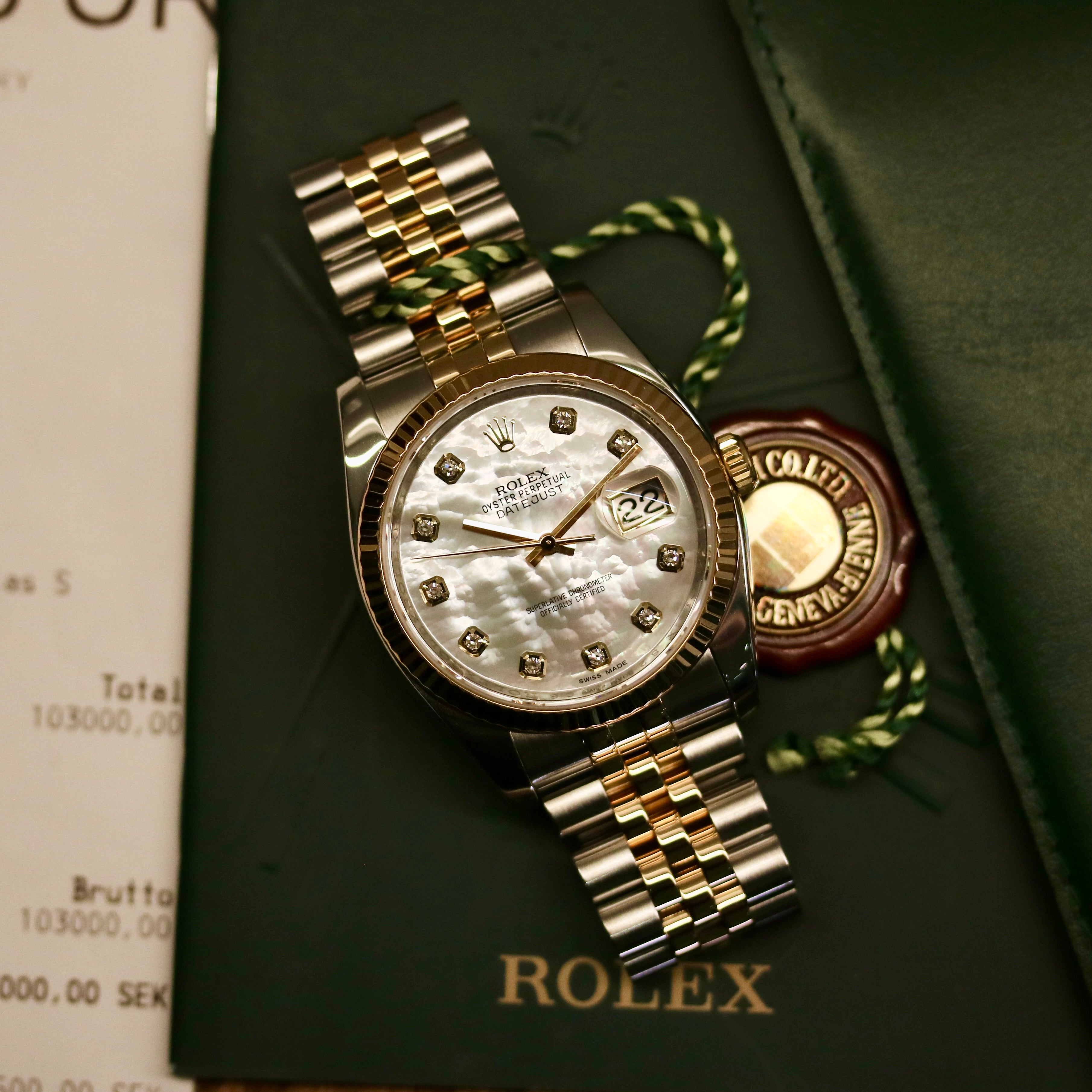 Rolex Datejust 36 ref. 116233 from 2013 in steel and yellow gold with a factory white mother-of-pearl diamond dial, 36mm case, Jubilee bracelet, sapphire crystal, and automatic movement. Detailed product photos showing the dial texture, diamond markers, two-tone case and bracelet, fluted bezel, and overall condition. Includes original Swedish papers from Nymans Ur, original receipt, 2020 service card, box, and tags, offered by Klocksalongen with a 12-month functional warranty.