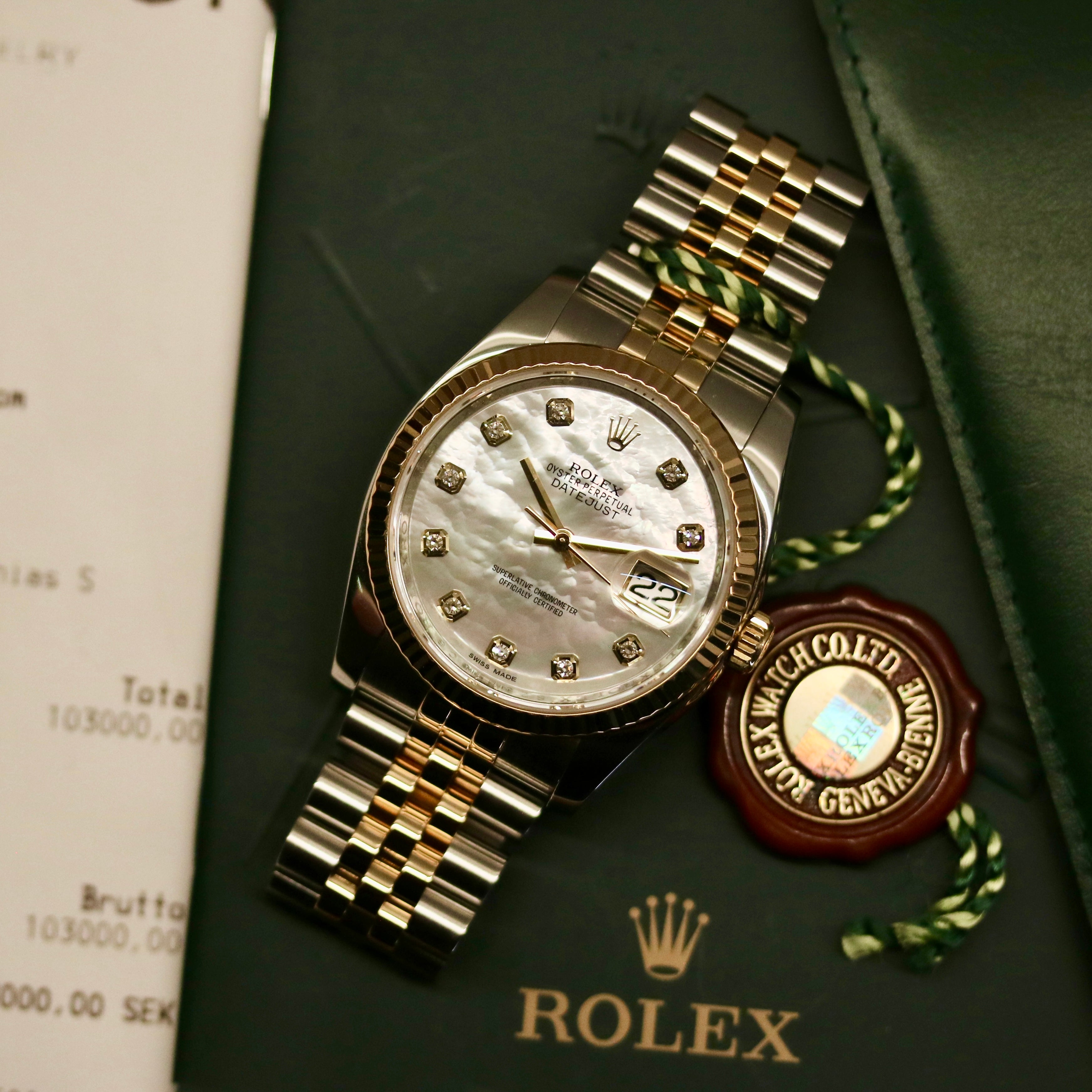 Rolex Datejust 36 ref. 116233 from 2013 in steel and yellow gold with a factory white mother-of-pearl diamond dial, 36mm case, Jubilee bracelet, sapphire crystal, and automatic movement. Detailed product photos showing the dial texture, diamond markers, two-tone case and bracelet, fluted bezel, and overall condition. Includes original Swedish papers from Nymans Ur, original receipt, 2020 service card, box, and tags, offered by Klocksalongen with a 12-month functional warranty.