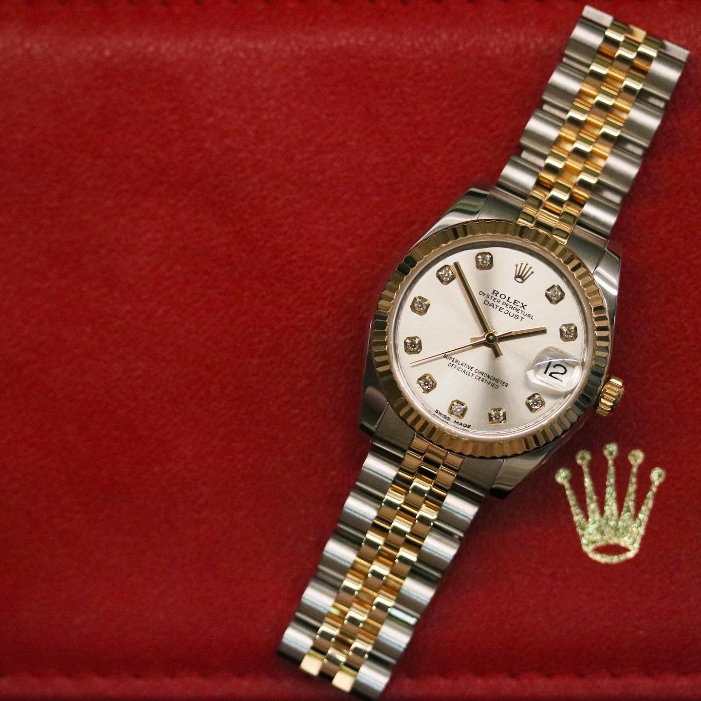 Rolex Datejust 31 ref. 178273 from 2012 in two-tone stainless steel and yellow gold with a factory silver diamond dial, 31mm case, Jubilee bracelet, sapphire crystal, and automatic movement. Presented in very good condition with original 2012 Netherlands certificate, box, tags, certificate holder, and booklets. Detailed product photos show the diamond markers, fluted bezel, case, bracelet, and clasp, offered by Klocksalongen with a 12-month functional warranty.