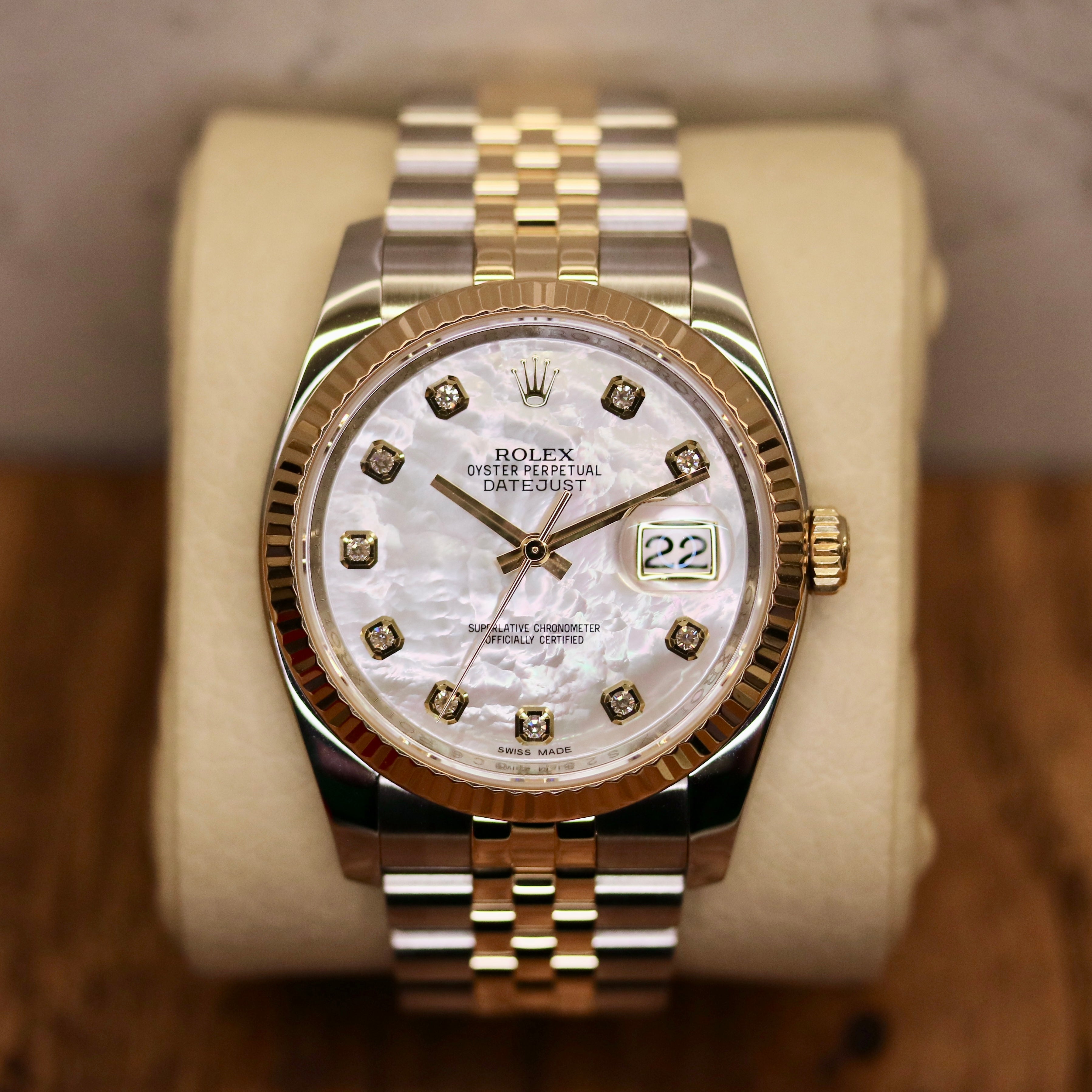 Rolex Datejust 36 ref. 116233 from 2013 in steel and yellow gold with a factory white mother-of-pearl diamond dial, 36mm case, Jubilee bracelet, sapphire crystal, and automatic movement. Detailed product photos showing the dial texture, diamond markers, two-tone case and bracelet, fluted bezel, and overall condition. Includes original Swedish papers from Nymans Ur, original receipt, 2020 service card, box, and tags, offered by Klocksalongen with a 12-month functional warranty.