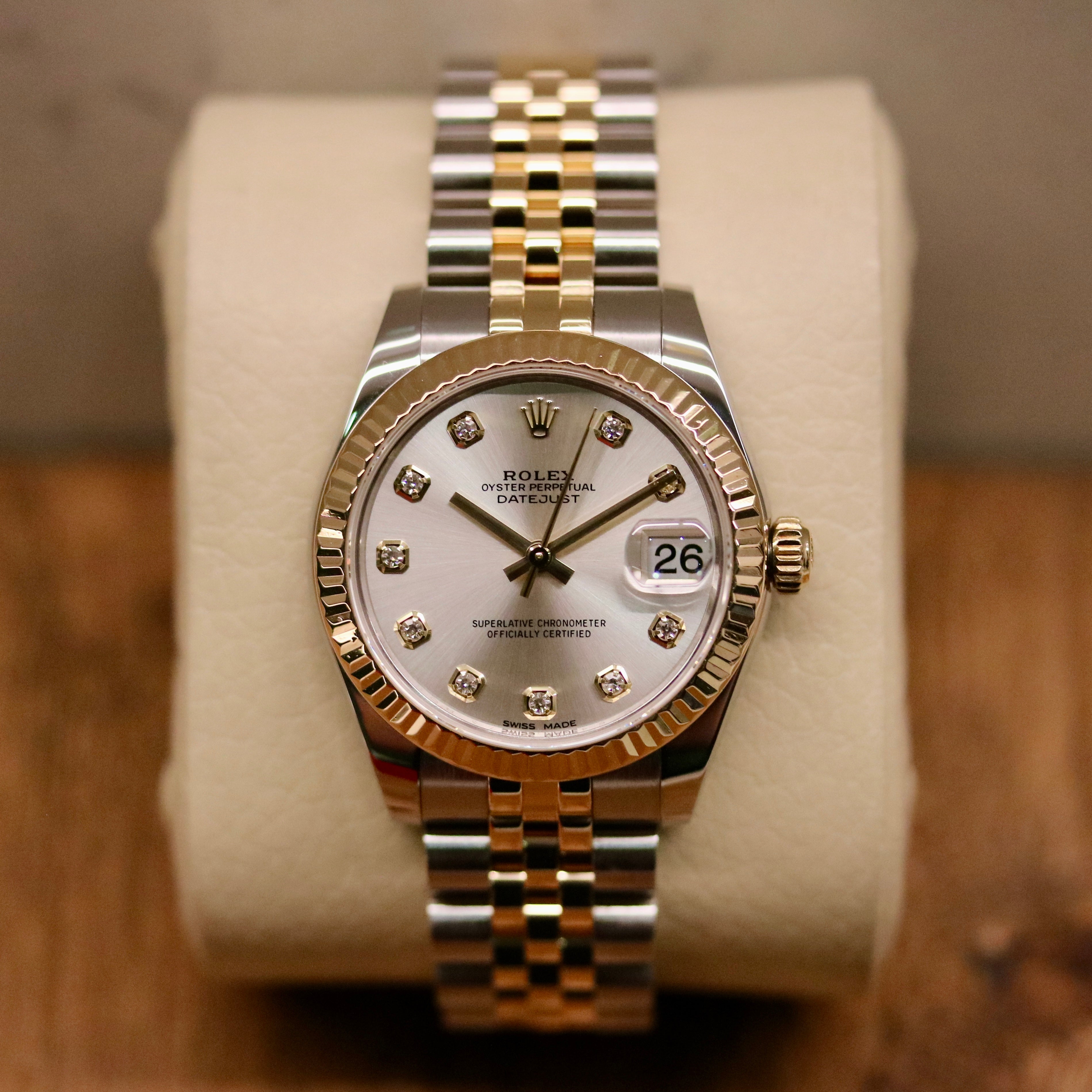 Rolex Datejust 31 ref. 178273 from 2018 in two-tone stainless steel and yellow gold with a factory silver diamond dial, 31mm case, Jubilee bracelet, sapphire crystal, and automatic movement. Presented in very good condition with original Egypt 2018 certificate, box, booklets, and tags. Includes photos detailing the diamond dial, fluted bezel, bracelet, case, and clasp, offered by Klocksalongen with a 12-month functional warranty.