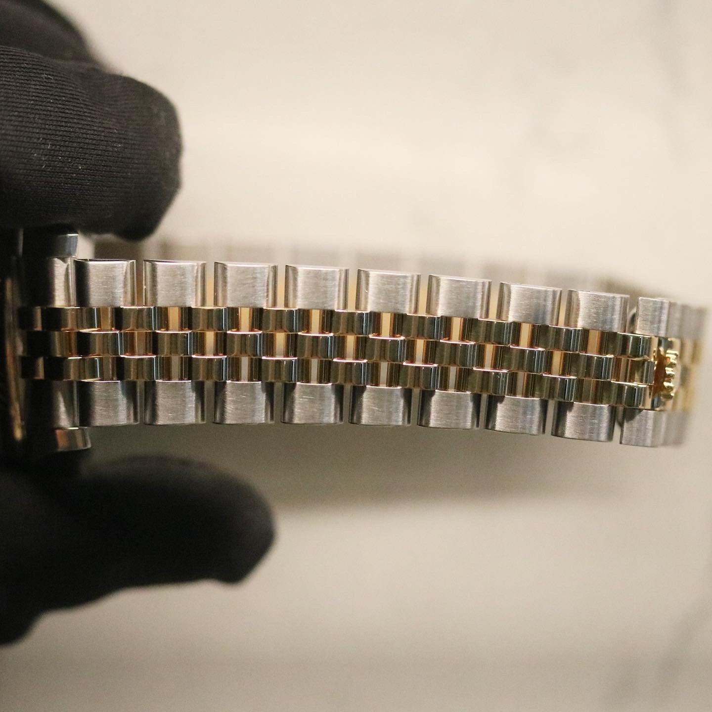 Rolex Datejust 31 ref. 178273 from 2012 in two-tone stainless steel and yellow gold with a factory silver diamond dial, 31mm case, Jubilee bracelet, sapphire crystal, and automatic movement. Presented in very good condition with original 2012 Netherlands certificate, box, tags, certificate holder, and booklets. Detailed product photos show the diamond markers, fluted bezel, case, bracelet, and clasp, offered by Klocksalongen with a 12-month functional warranty.