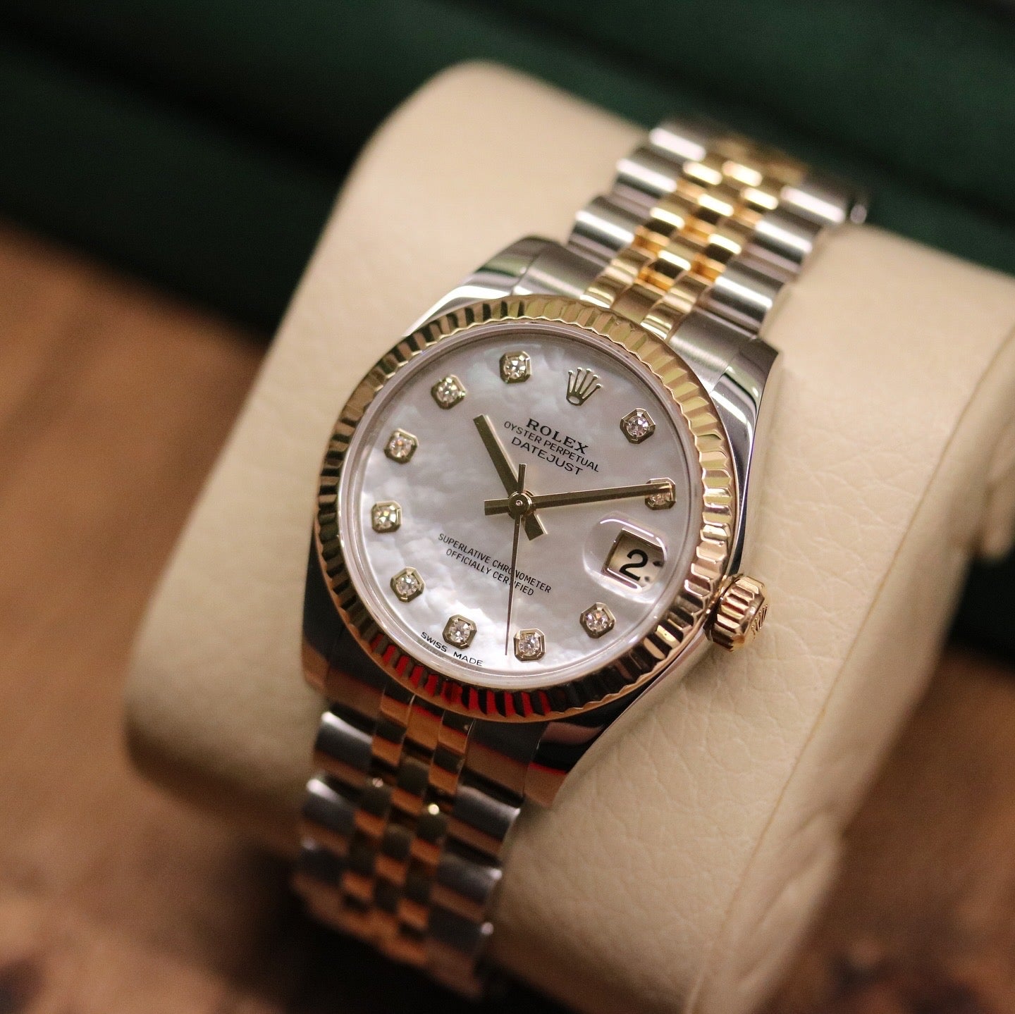 Rolex Datejust 31 ref. 178273 from 2017 in two-tone stainless steel and yellow gold with a factory white mother-of-pearl diamond dial, 31mm case, Jubilee bracelet, sapphire crystal, and automatic movement. Very good condition, complete with original 2017 Bergströms Uppsala certificate, box, booklets, and tag. Detailed product images showing the MOP dial texture, diamond markers, fluted bezel, case, bracelet, and clasp, offered by Klocksalongen with a 12-month functional warranty.