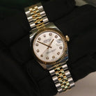 Rolex Datejust 31 ref. 178273 from 2012 in two-tone stainless steel and yellow gold with a factory silver diamond dial, 31mm case, Jubilee bracelet, sapphire crystal, and automatic movement. Presented in very good condition with original 2012 Netherlands certificate, box, tags, certificate holder, and booklets. Detailed product photos show the diamond markers, fluted bezel, case, bracelet, and clasp, offered by Klocksalongen with a 12-month functional warranty.