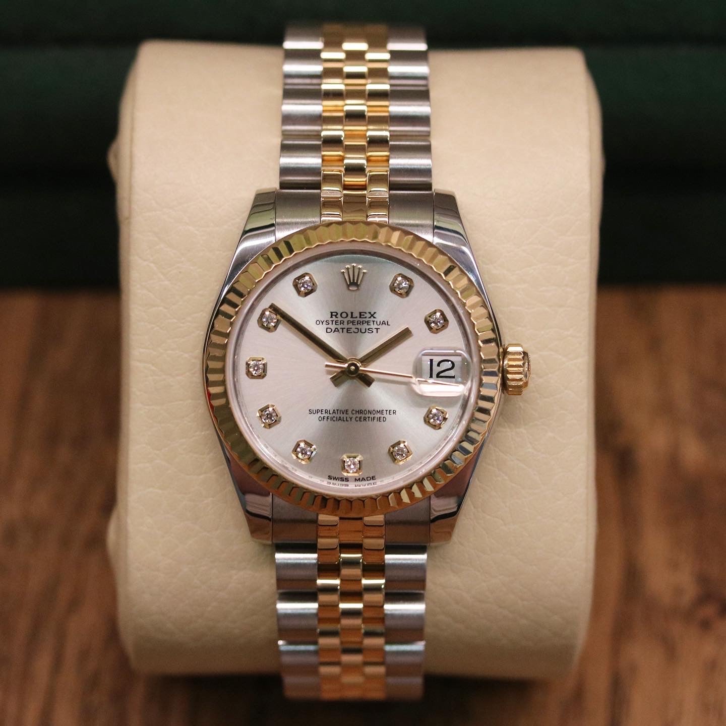 Rolex Datejust 31 ref. 178273 from 2012 in two-tone stainless steel and yellow gold with a factory silver diamond dial, 31mm case, Jubilee bracelet, sapphire crystal, and automatic movement. Presented in very good condition with original 2012 Netherlands certificate, box, tags, certificate holder, and booklets. Detailed product photos show the diamond markers, fluted bezel, case, bracelet, and clasp, offered by Klocksalongen with a 12-month functional warranty.