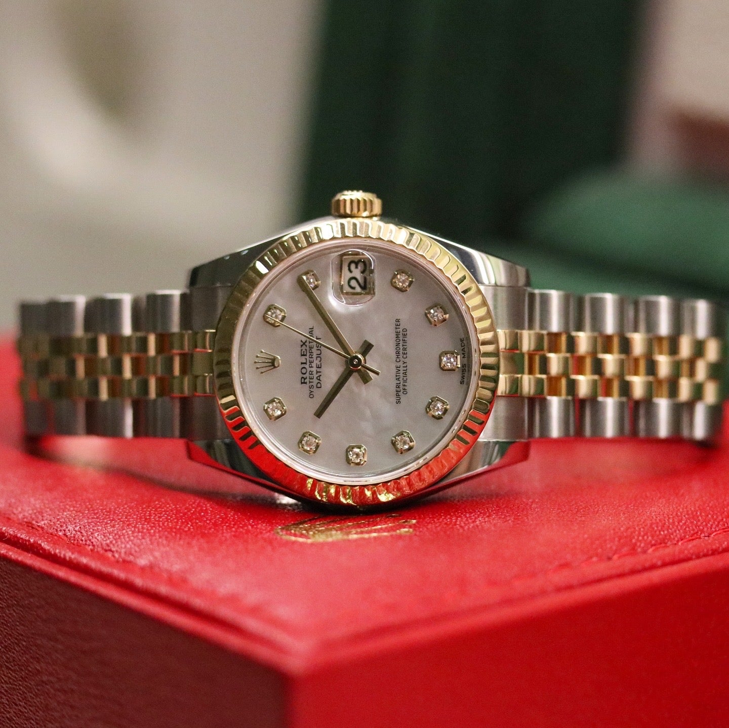Rolex Datejust 31 ref. 178273 from 2017 in two-tone stainless steel and yellow gold with a factory white mother-of-pearl diamond dial, 31mm case, Jubilee bracelet, sapphire crystal, and automatic movement. Very good condition, complete with original 2017 Bergströms Uppsala certificate, box, booklets, and tag. Detailed product images showing the MOP dial texture, diamond markers, fluted bezel, case, bracelet, and clasp, offered by Klocksalongen with a 12-month functional warranty.