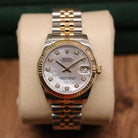 Rolex Datejust 31 ref. 178273 from 2017 in two-tone stainless steel and yellow gold with a factory white mother-of-pearl diamond dial, 31mm case, Jubilee bracelet, sapphire crystal, and automatic movement. Very good condition, complete with original 2017 Bergströms Uppsala certificate, box, booklets, and tag. Detailed product images showing the MOP dial texture, diamond markers, fluted bezel, case, bracelet, and clasp, offered by Klocksalongen with a 12-month functional warranty.