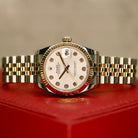 Rolex Datejust 31 ref. 178273 from 2018 in two-tone stainless steel and yellow gold with a factory silver diamond dial, 31mm case, Jubilee bracelet, sapphire crystal, and automatic movement. Presented in very good condition with original Egypt 2018 certificate, box, booklets, and tags. Includes photos detailing the diamond dial, fluted bezel, bracelet, case, and clasp, offered by Klocksalongen with a 12-month functional warranty.