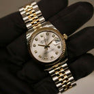 Rolex Datejust 31 ref. 178273 from 2018 in two-tone stainless steel and yellow gold with a factory silver diamond dial, 31mm case, Jubilee bracelet, sapphire crystal, and automatic movement. Presented in very good condition with original Egypt 2018 certificate, box, booklets, and tags. Includes photos detailing the diamond dial, fluted bezel, bracelet, case, and clasp, offered by Klocksalongen with a 12-month functional warranty.