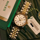 Rolex Datejust 31 ref. 178273 from 2018 in two-tone stainless steel and yellow gold with a factory silver diamond dial, 31mm case, Jubilee bracelet, sapphire crystal, and automatic movement. Presented in very good condition with original Egypt 2018 certificate, box, booklets, and tags. Includes photos detailing the diamond dial, fluted bezel, bracelet, case, and clasp, offered by Klocksalongen with a 12-month functional warranty.