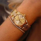 Rolex Datejust 31 ref. 68238 from 2000 in solid yellow gold with factory diamond-set bezel and a factory champagne big diamond dial, 31mm case, President bracelet, sapphire crystal, and automatic movement. Excellent condition, freshly serviced, and complete with original 2000 Spain certificate, box, booklets, and tag. Detailed product photos showing the diamond bezel, large diamond markers, gold case, bracelet, clasp, and finishing, offered by Klocksalongen with a 12-month service warranty.