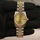 Rolex Datejust 31 ref. 68273 from 1988 in two-tone stainless steel and yellow gold with a factory champagne diamond dial, 31mm case, Jubilee bracelet, sapphire crystal, and automatic movement. Provided in very good condition with a Rolex pouch. Detailed product photos showing the champagne diamond dial, fluted bezel, case, bracelet, clasp, and finishing, offered by Klocksalongen with a 12-month functional warranty.