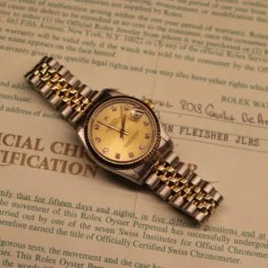 Rolex Datejust 31 ref. 68273 from 1989 in two-tone stainless steel and yellow gold with a factory champagne diamond dial, 31mm case, Jubilee bracelet, sapphire crystal, and automatic movement. Freshly serviced and polished, in very good condition. Complete full set including original 1989 USA certificate, box, booklets, and tag. Detailed product photos showing the diamond-set dial, fluted bezel, case, bracelet, and clasp, offered by Klocksalongen with a 12-month service warranty.