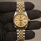 Rolex Datejust 31 ref. 68273 from 1990 in two-tone stainless steel and yellow gold with a factory silver diamond dial, 31mm case, Jubilee bracelet, sapphire crystal, and automatic movement. Unpolished example in extremely good condition with original Spain certificate, box, booklets, and tag. Detailed product photos showing the dial, diamond markers, bezel, case, bracelet, and clasp, available from Klocksalongen with a 12-month functional warranty.