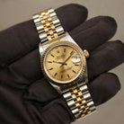 Rolex Datejust 31 ref. 68273 from 1990 in two-tone stainless steel and yellow gold with a factory silver diamond dial, 31mm case, Jubilee bracelet, sapphire crystal, and automatic movement. Unpolished example in extremely good condition with original Spain certificate, box, booklets, and tag. Detailed product photos showing the dial, diamond markers, bezel, case, bracelet, and clasp, available from Klocksalongen with a 12-month functional warranty.