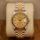 Rolex Datejust 31 ref. 68273 from 1990 in two-tone stainless steel and yellow gold with a factory silver diamond dial, 31mm case, Jubilee bracelet, sapphire crystal, and automatic movement. Unpolished example in extremely good condition with original Spain certificate, box, booklets, and tag. Detailed product photos showing the dial, diamond markers, bezel, case, bracelet, and clasp, available from Klocksalongen with a 12-month functional warranty.