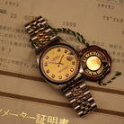 Rolex Datejust 31 ref. 68273 from 1999 in two-tone stainless steel and yellow gold with a factory champagne diamond dial, 31mm case, Jubilee bracelet, sapphire crystal, and automatic movement. Recently serviced and polished, delivered in very good condition with original Japan 1999 certificate, box, booklets, and tag. Detailed product images show the diamond-set dial, fluted bezel, case, bracelet, clasp, and finishing, offered by Klocksalongen with a 12-month service warranty.