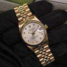 Rolex Datejust 31 ref. 68278 from 1991 in solid yellow gold with a factory silver diamond dial, 31mm case, President bracelet, sapphire crystal, and automatic movement. Presented in very good condition with Klocksalongen authenticity certificate and packaging. Detailed product photos showing the diamond-set dial, gold case, bracelet, clasp, and overall finish, offered with a 12-month functional warranty.