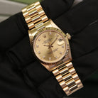 Rolex Datejust 31 ref. 68278 from 1992 in solid yellow gold with a factory champagne diamond dial, 31mm case, President bracelet, sapphire crystal, and automatic movement. Top-condition example, complete with original Spain 1992 certificate, box, booklets, and tag. Detailed product images showing the champagne diamond dial, gold bezel, case, bracelet links, and clasp, offered by Klocksalongen with a 12-month functional warranty.