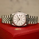 Rolex Datejust 36 ref. 16014 from 1984 with a white-gold fluted bezel and stainless-steel case and bracelet, featuring a silver dial, sapphire crystal, automatic movement, and very good condition; detailed product photos showing the dial, bezel, case profile, bracelet, and overall finishing, offered by Klocksalongen with authenticity certificate and 12-month functional warranty.