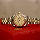 Rolex Lady-Datejust 26 ref. 69173 from 1986 in two-tone stainless steel and yellow gold with a champagne dial, 26mm case, Jubilee bracelet, sapphire crystal, and automatic movement. Recently polished and presented in good condition with Klocksalongen authenticity certificate and packaging. Detailed photos show the champagne dial, gold fluted bezel, case, bracelet, and clasp, offered with a 12-month functional warranty.