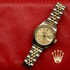 Rolex Lady-Datejust 26 ref. 69173 from 1986 in two-tone stainless steel and yellow gold with a champagne dial, 26mm case, Jubilee bracelet, sapphire crystal, and automatic movement. Recently polished and presented in good condition with Klocksalongen authenticity certificate and packaging. Detailed photos show the champagne dial, gold fluted bezel, case, bracelet, and clasp, offered with a 12-month functional warranty.