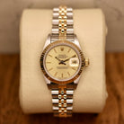 Rolex Lady-Datejust 26 ref. 69173 from 1986 in two-tone stainless steel and yellow gold with a champagne dial, 26mm case, Jubilee bracelet, sapphire crystal, and automatic movement. Recently polished and presented in good condition with Klocksalongen authenticity certificate and packaging. Detailed photos show the champagne dial, gold fluted bezel, case, bracelet, and clasp, offered with a 12-month functional warranty.