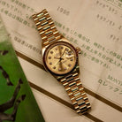 Rolex Lady-Datejust 26 ref. 69178 from 1996 in solid yellow gold with a factory champagne diamond dial, 26mm case, President bracelet, sapphire crystal, and automatic movement. Includes original Japan certificate, box, and tag. Detailed product photos showing the dial, diamonds, case, bracelet, clasp, and overall very good condition, offered by Klocksalongen with a 12-month functional warranty.